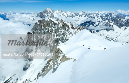 Mont Blanc mountain massif summer landscape (view from Aiguille du Midi Mount, France ). All people are not recognizable.