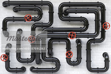 Black oil pipes on a brick wall.