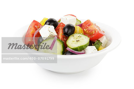 fresh greek salad in white bowl, isolated on white