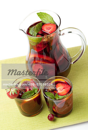 Cocktail collection - Refreshing fruit sangria in jug and two glasses. Above view, isolated on white