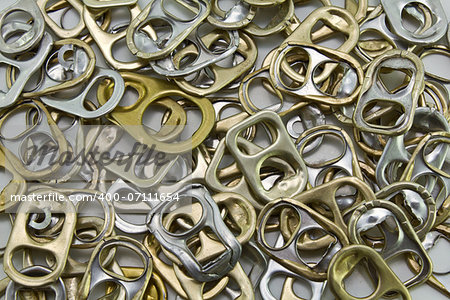 Metal ring pulls aluminum cans