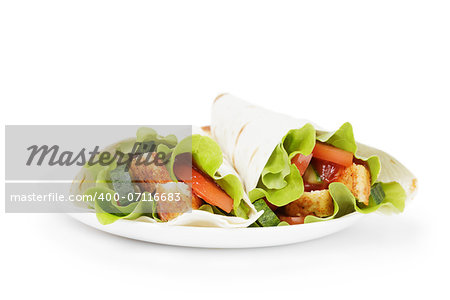 wheat tortilla with chicken and vegetables on plate, white background