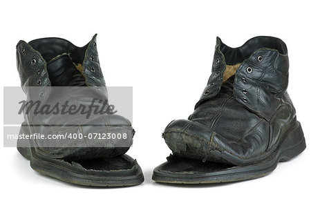 Pair of torn old boots  isolated on the white background