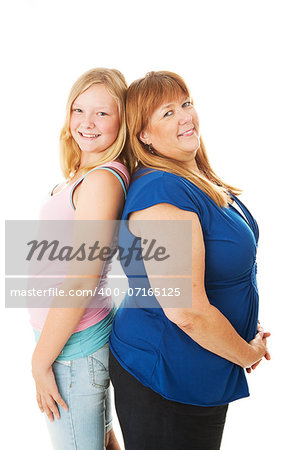 Pretty teenage daughter has grown taller than her mother.  Isolated on white.