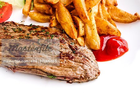 juicy steak beef meat with tomato and french fries