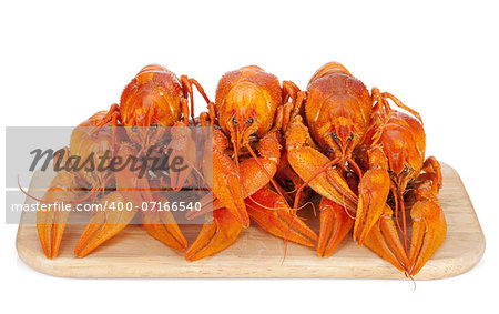 Boiled crayfishes on cutting board. Isolated on white background