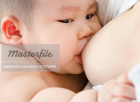 Mother and baby. Close up Asian mother breastfeeding baby boy