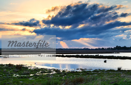 dramatic clouds at sunset over swamp, Drenthe, Netherlands