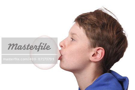 Young boy with a bubble of chewing gum on white background