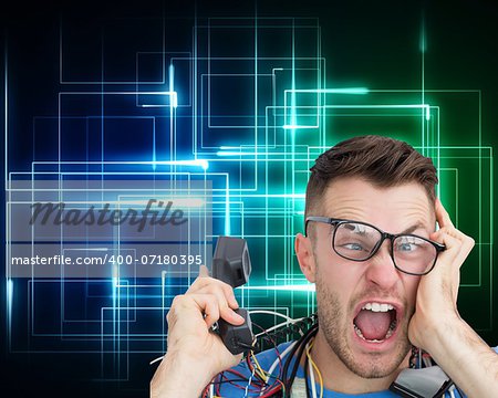 Composite image of frustrated computer engineer screaming while on call on black background with glowing lines