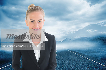 Composite image of blonde usinesswoman holding tablet