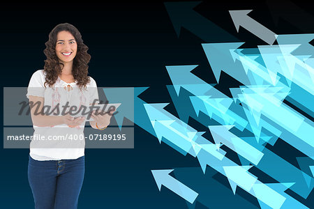 Composite image of smiling casual brunette using her tablet pc