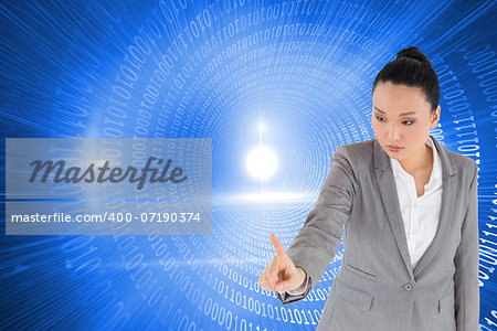 Composite image of unsmiling asian businesswoman pointing