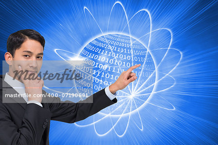 Composite image of thoughtful asian businessman pointing