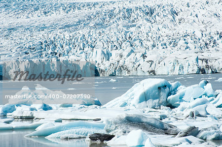 Beautiful photo of Fjallsarlon Glacial lake full of floating icebergs near the Fjallsjokull glacier