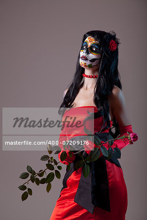 Sugar skull girl in red evening dress, Halloween shot