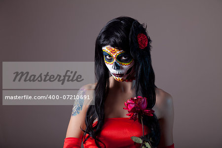 Portrait of sugar skull girl with red rose, Day of the Dead Halloween theme