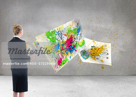 Composite image of blonde businesswoman holding new tablet