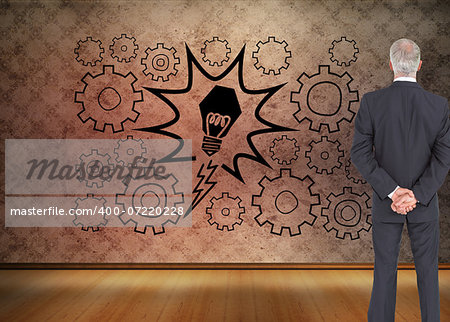Composite image of rear view of serious businessman posing on white background