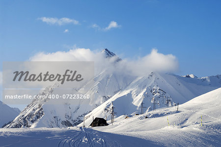 Snow skiing piste at evening. Caucasus Mountains. Georgia, ski resort Gudauri