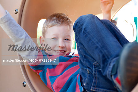 playful little boy having fun at playground