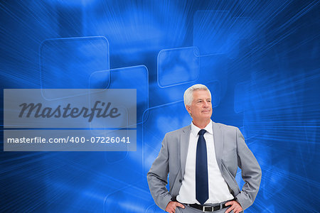 Composite image of man in a suit with his hands on his hips