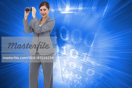 Composite image of businesswoman posing with binoculars