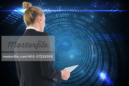 Composite image of blonde businesswoman holding tablet