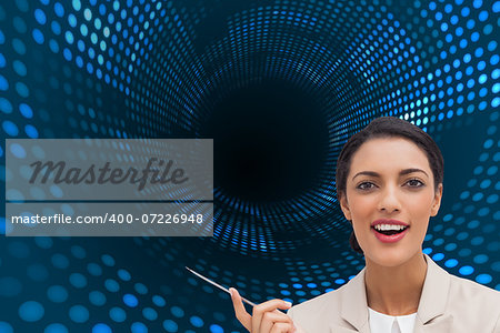 Composite image of smiling businesswoman holding a pen