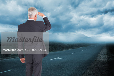 Composite image of rear view of mature businessman looking away