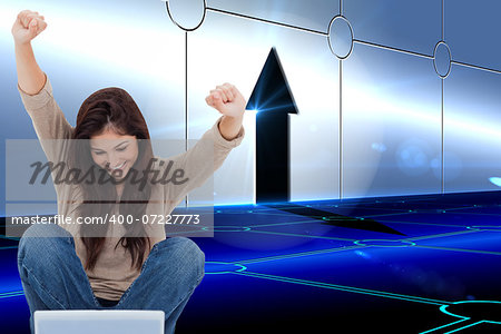 Composite image of pretty brunette cheering while using laptop