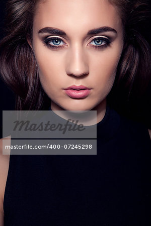 dark beautiful girl portrait with blue eyes