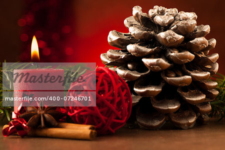 Pine cone and candle cristmas decoration