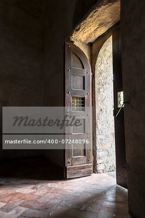 Old wooden door of the church in backlight