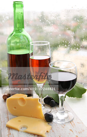 still life with wine bottle, wine glass and grapes