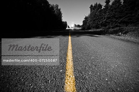 Empty Country road with Yellow Dividing line at Night