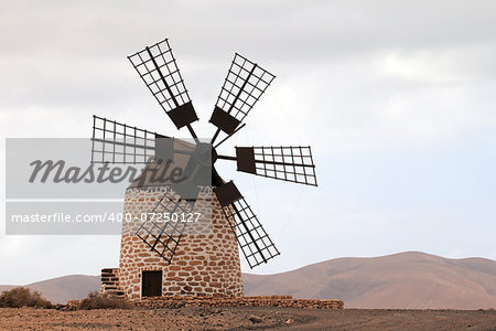 Puesta del sol de Tefia windmill in Fuerteventura Island (Spain)
