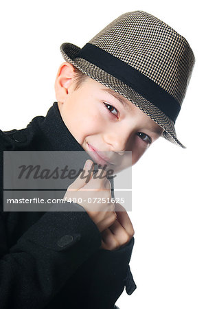Young boy wearing a hat over white background