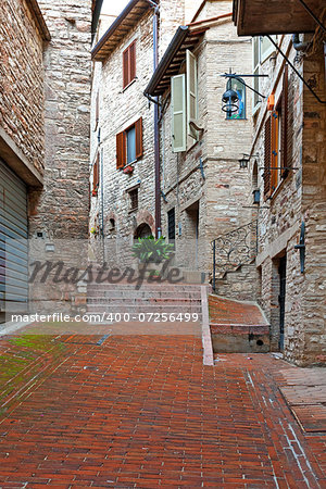 Narrow Alley with Old Buildings in Italian City of Assisi