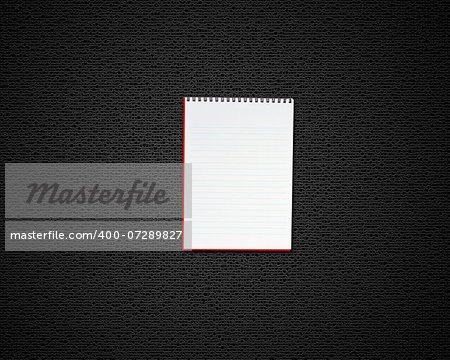 blank opened notebook on black background.