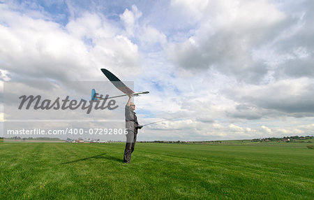 Man launches into the sky RC glider, wide-angle