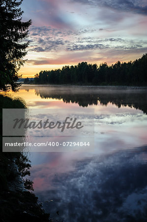 Dramatic sunset over the river in Karelia, the north of Russia