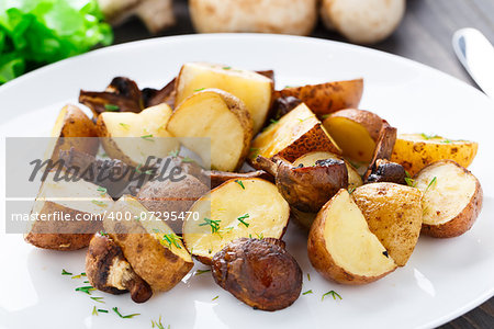 Roasted potato and mushrooms on a plate