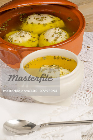 Traditional homemade matza ball soup served in a bowl