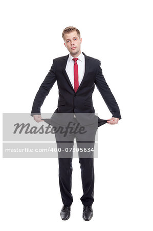 Broke businessman with empty pockets on white