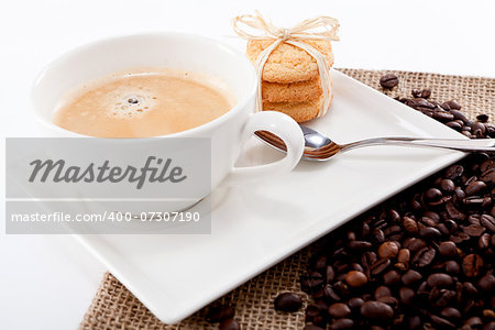 fresh aromatic coffee and cookies on wooden table