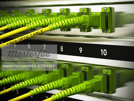 Close up of optical fiber optic patchcords inside a network infrastructure. Blur effect with focus on one cable.