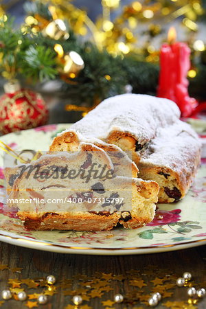 Dish with Christmas stollen on a celebratory table.
