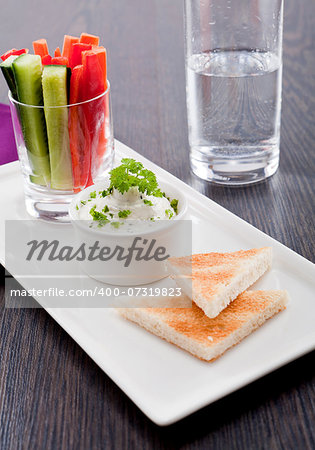 fresh vegetables snack and cream cheese dip with bread on plate