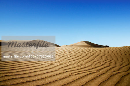 Gold desert into the sunset. Canary Islands, Canaries. Grand Canary. Maspalomas, Resort Town.